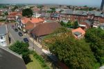 11: The coastline comes back into view over the rooftops as we complete our first circle back to St.Edmunds Church, just visible on the right of the picture.