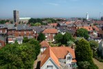 1: Looking out over Southwold on a lovely day in Summer 2006, from the top of the tower of the Roman Catholic Church of the Sacred Heart. Starting by looking to the East; here St Edmunds Church stands to the left and Southwolds famous lighthouse to the right.  The High Street is down there somewhere !