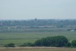 31: Looking over the town to Gun Hill on which stand six Elizabethan cannon lined-up and pointing out to sea. Also at Gun Hill stands this flagpole, centre picture, and the Southwold Beacon just to the left of the flagpole, peeking over a rooftop.