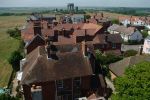 7: Looking away from the coast and with the water towers on the Common clearly in view. Nowadays joyful Kite-flying usually takes place on Southwold Common but for most of the 1800s Black Mill windmill stood at the far end of these properties, using the wind for more prosaic purposes.